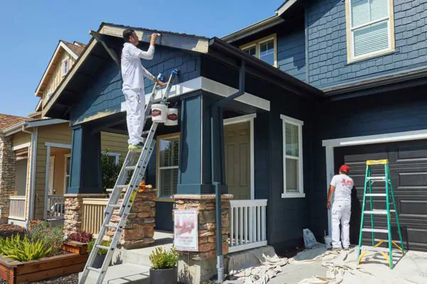 two contractors painting residential house