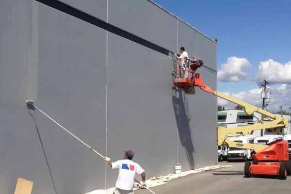 two contractors painting a commercial establishment 