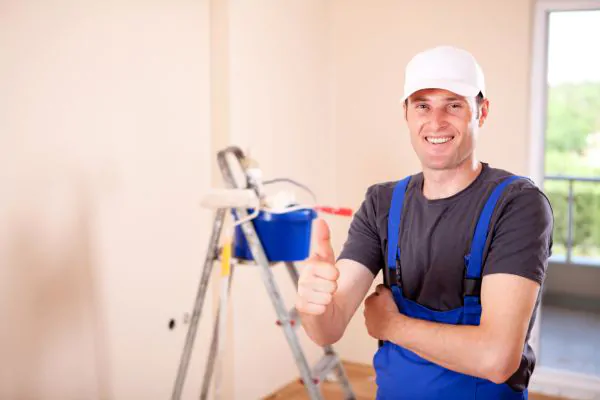 smiling house painter thumbs up